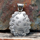The back features the artisans initials and southwestern stamping.