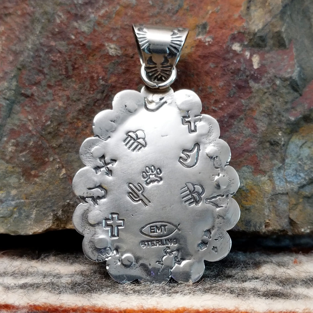 The back features the artisans initials and southwestern stamping.