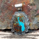 Sterling silver pendant with frilled edges and Redskin Turquoise centerpiece.