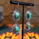 Earrings with Sonoran Gold turquoise set in sterling silver bezels, framed by twisted rope and frilled-edge settings.