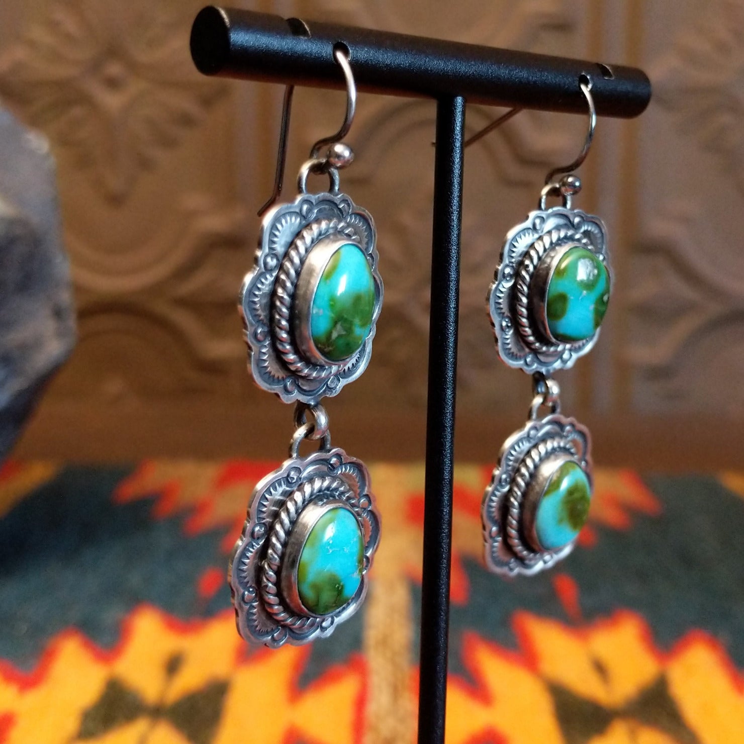 Earrings with Sonoran Gold turquoise set in sterling silver bezels, framed by twisted rope and frilled-edge settings.