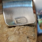 Close-up of the artisan's stamped signature.