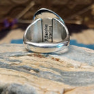 Sterling silver ring with Kingman turquoise set in the gibbous-shaped bezel, framed by twisted rope accents.