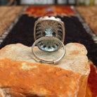 The back features the adjustable band for larger sizing.