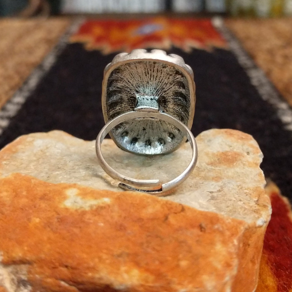 The back features the adjustable band for larger sizing.