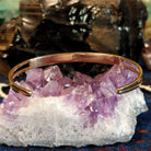 The back of the bracelet features the polished gold finish of the bracelet.