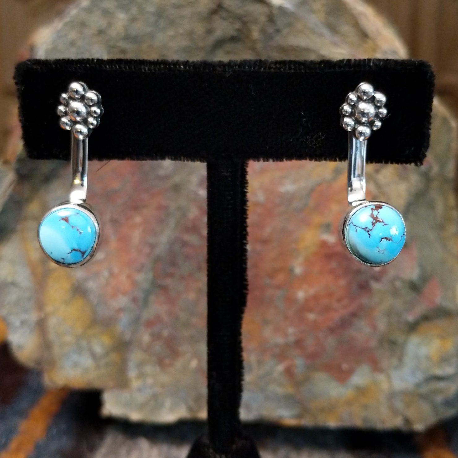 Golden Hills turquoise adjustable earrings with round Golden Hills turquoise stones and light brown matrix veining set in sterling silver with a smooth bezel, crafted by Navajo artist Terry Wood.