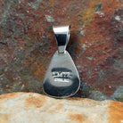 The back view shows the stamp and signature on the back of the sterling silver pendant.