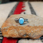 Golden Hills turquoise silver ring by Raymond Coriz with textured band.