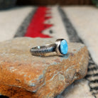 Golden Hills turquoise silver ring by Raymond Coriz with textured band.
