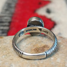 Close up of the artist's stamped signature