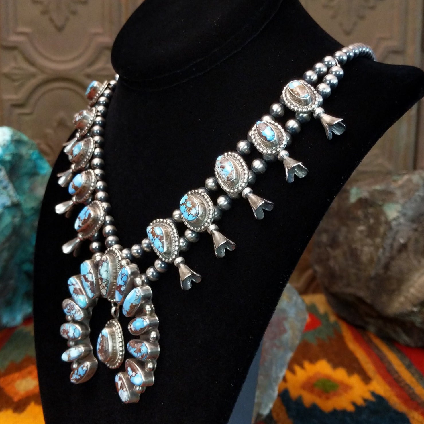 Golden Hills turquoise necklace with naja pendant and matching earrings.