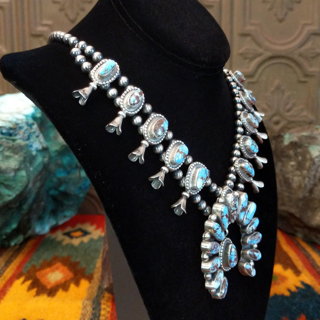 Golden Hills turquoise necklace with naja pendant and matching earrings.