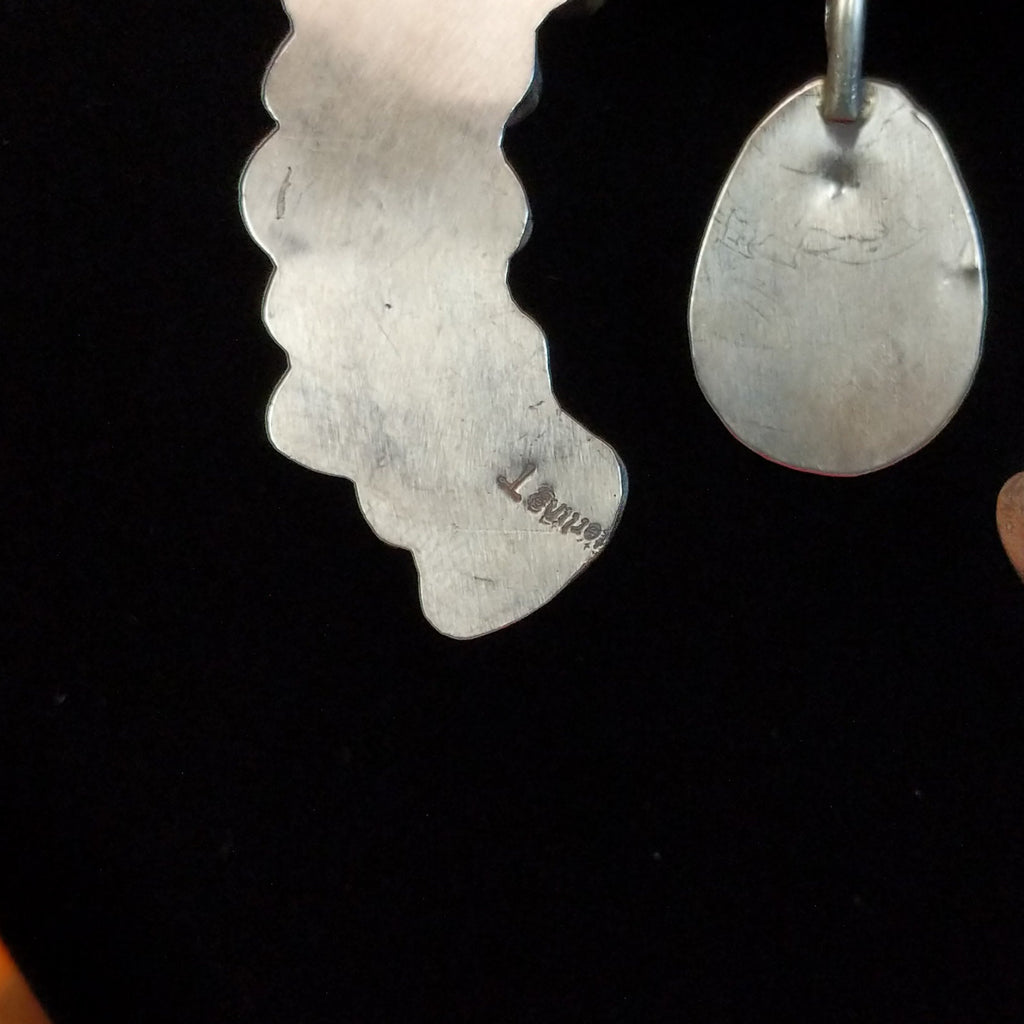 A close-up of the artist's signature.