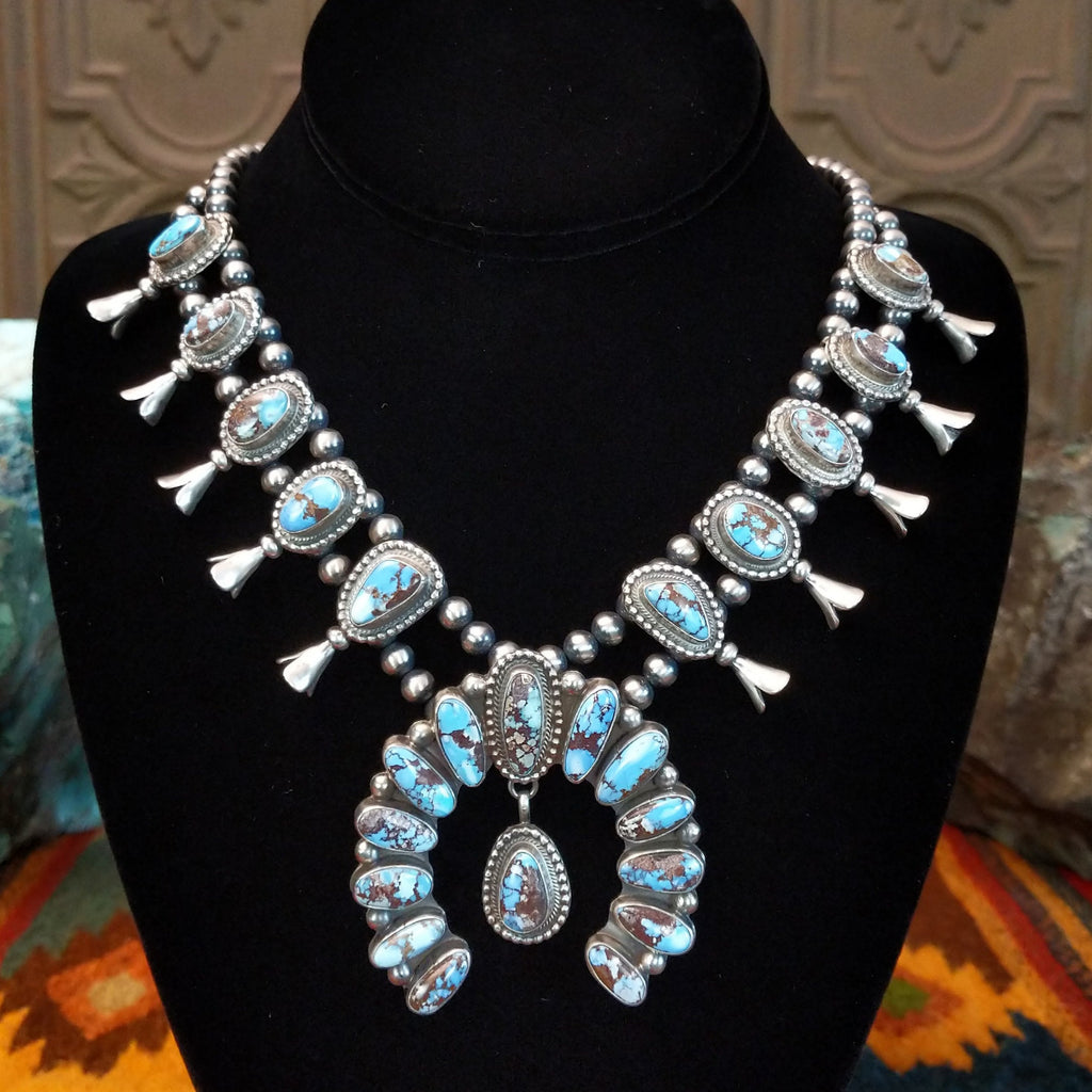 Golden Hills turquoise necklace with naja pendant and matching earrings.
