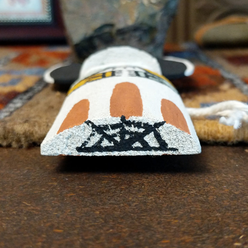 The underside of the piece showcases the painting signature.