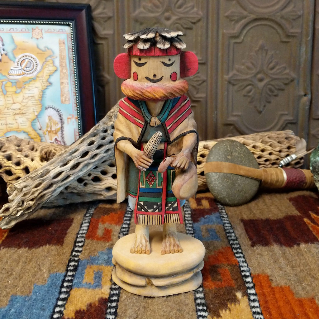 Wood carved into a grandmother kachina with finely carved wood details and colorful painted accents.