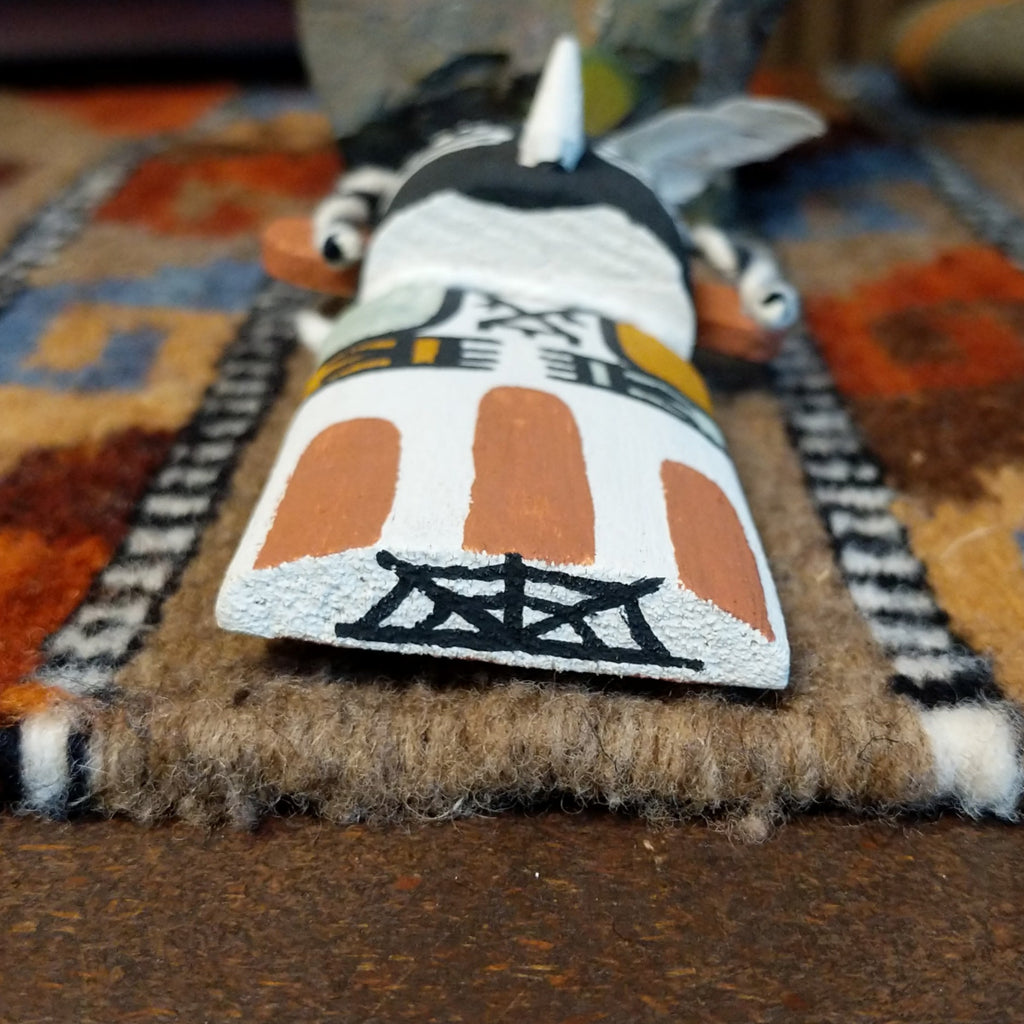 The bottom of the piece is signed.