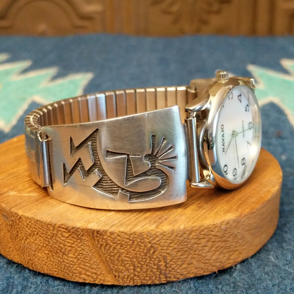 Sterling silver and stainless steel watch with kokopelli motifs on the bracelet and semi-adjustable band.