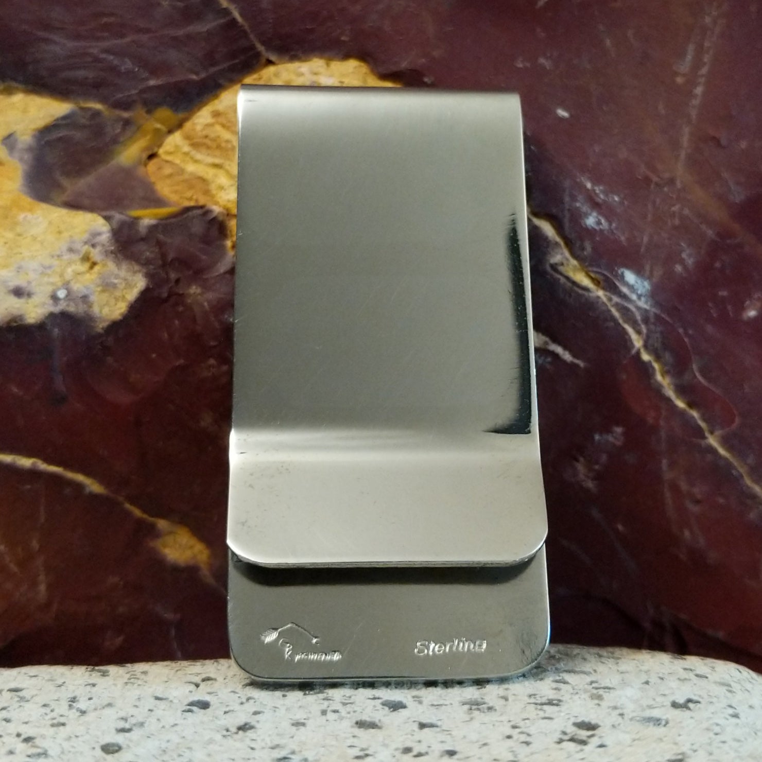 Smooth stainless steel backing of the clip.