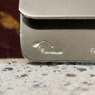 Artists signature on the inside of the sterling silver face.