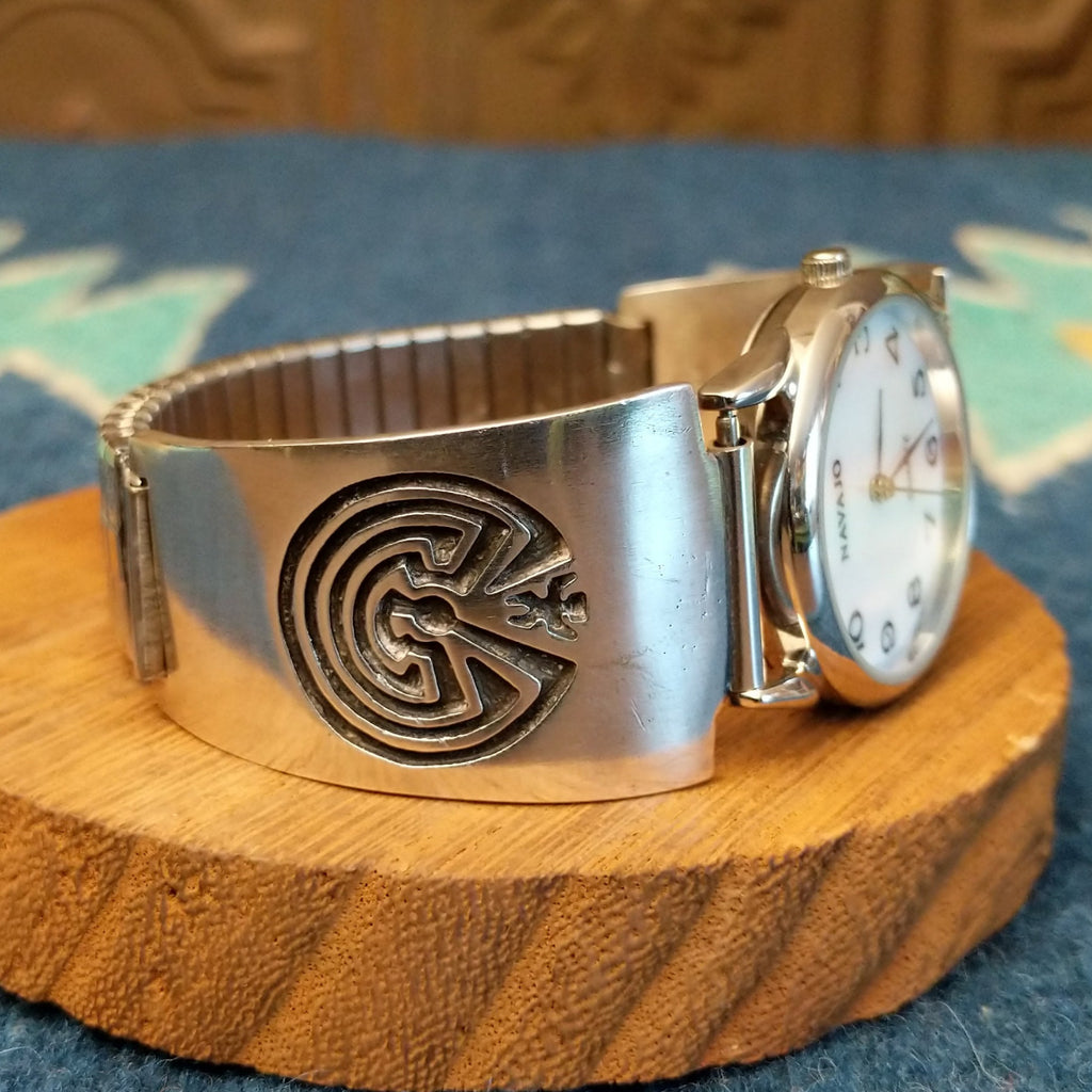 Sterling silver watch with the man in the maze motif and semi-adjustable bracelet.