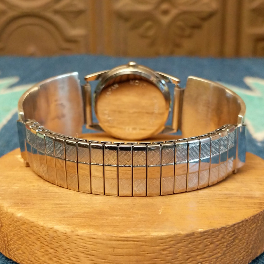 Sterling silver watch with the man in the maze motif and semi-adjustable bracelet.