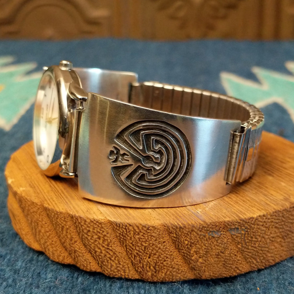Sterling silver watch with the man in the maze motif and semi-adjustable bracelet.