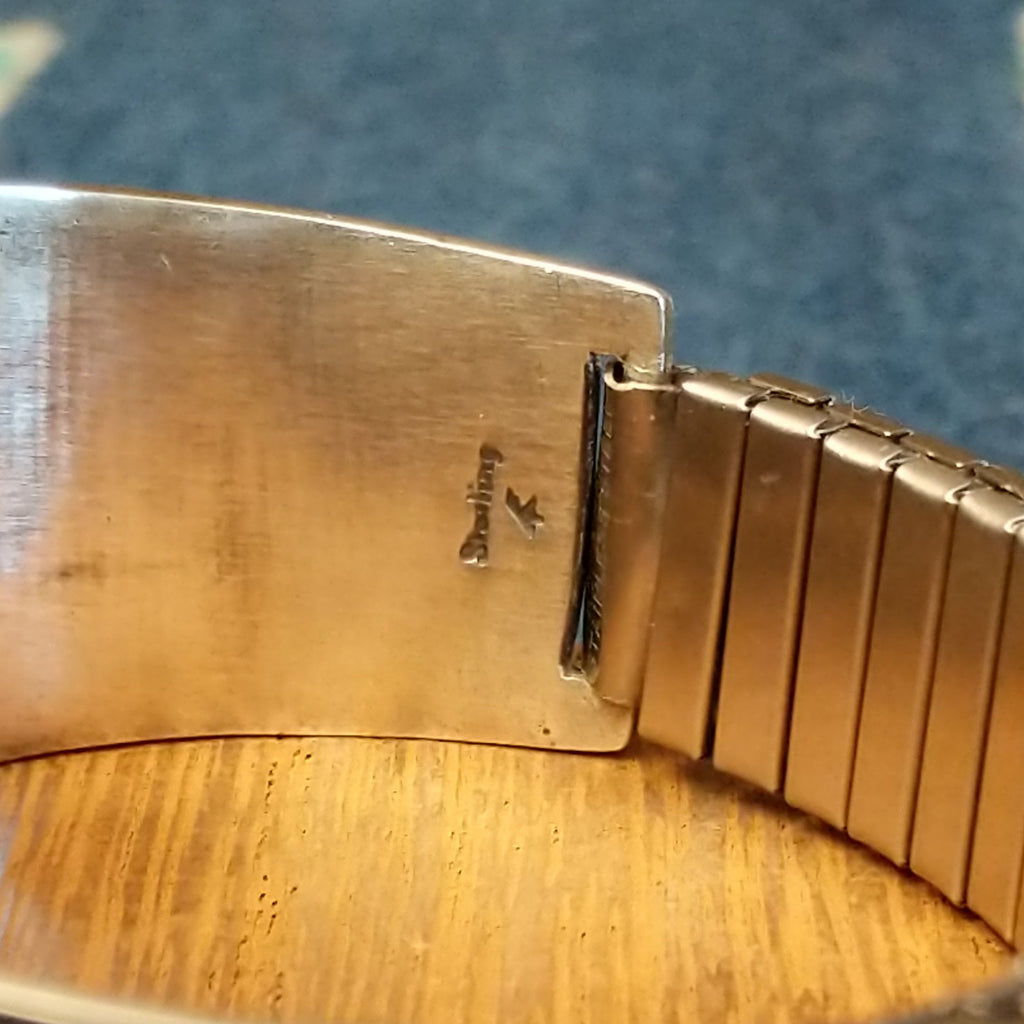 The sterling silver stamp is found on the interior of the band.