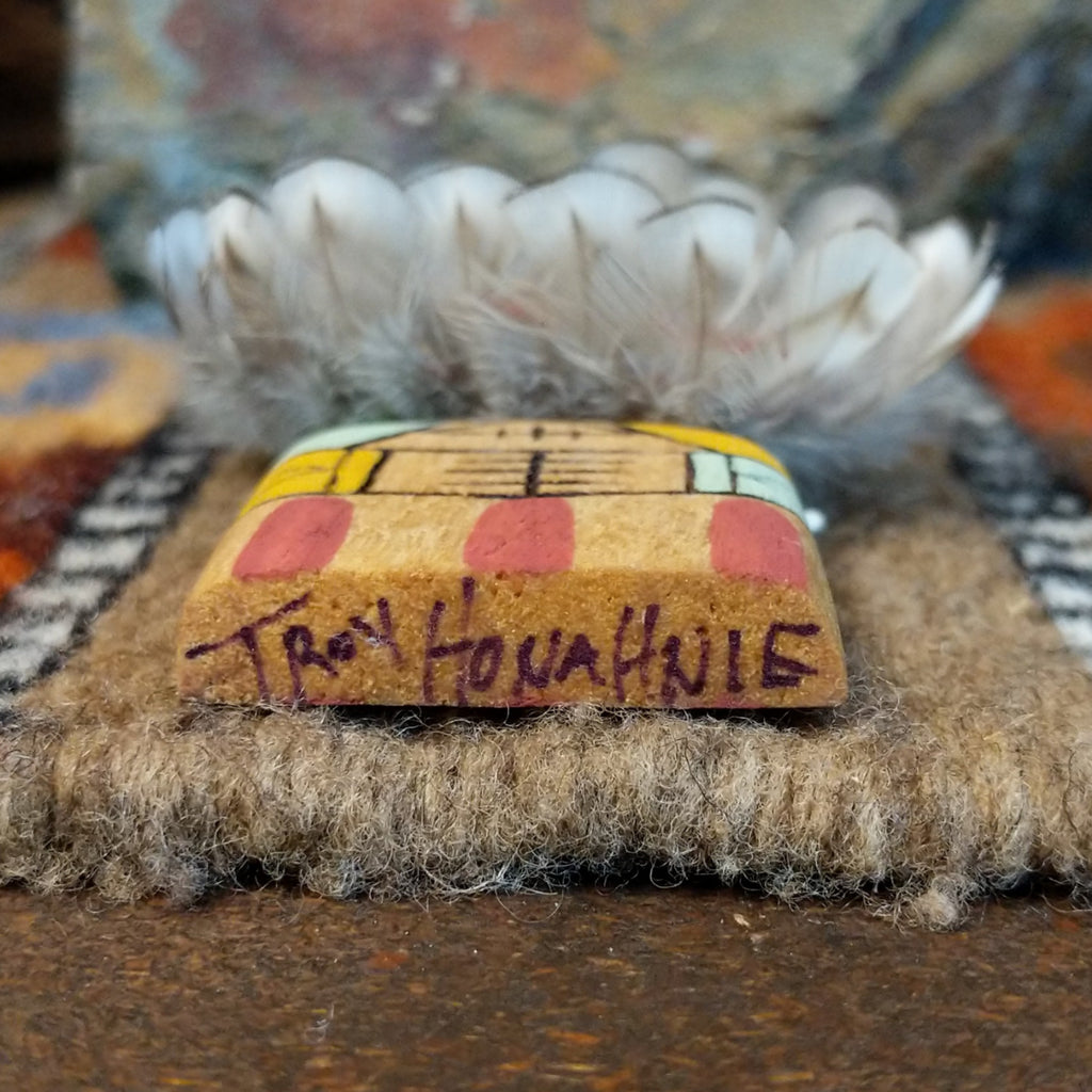 The underside of the piece features the artisan's signature.