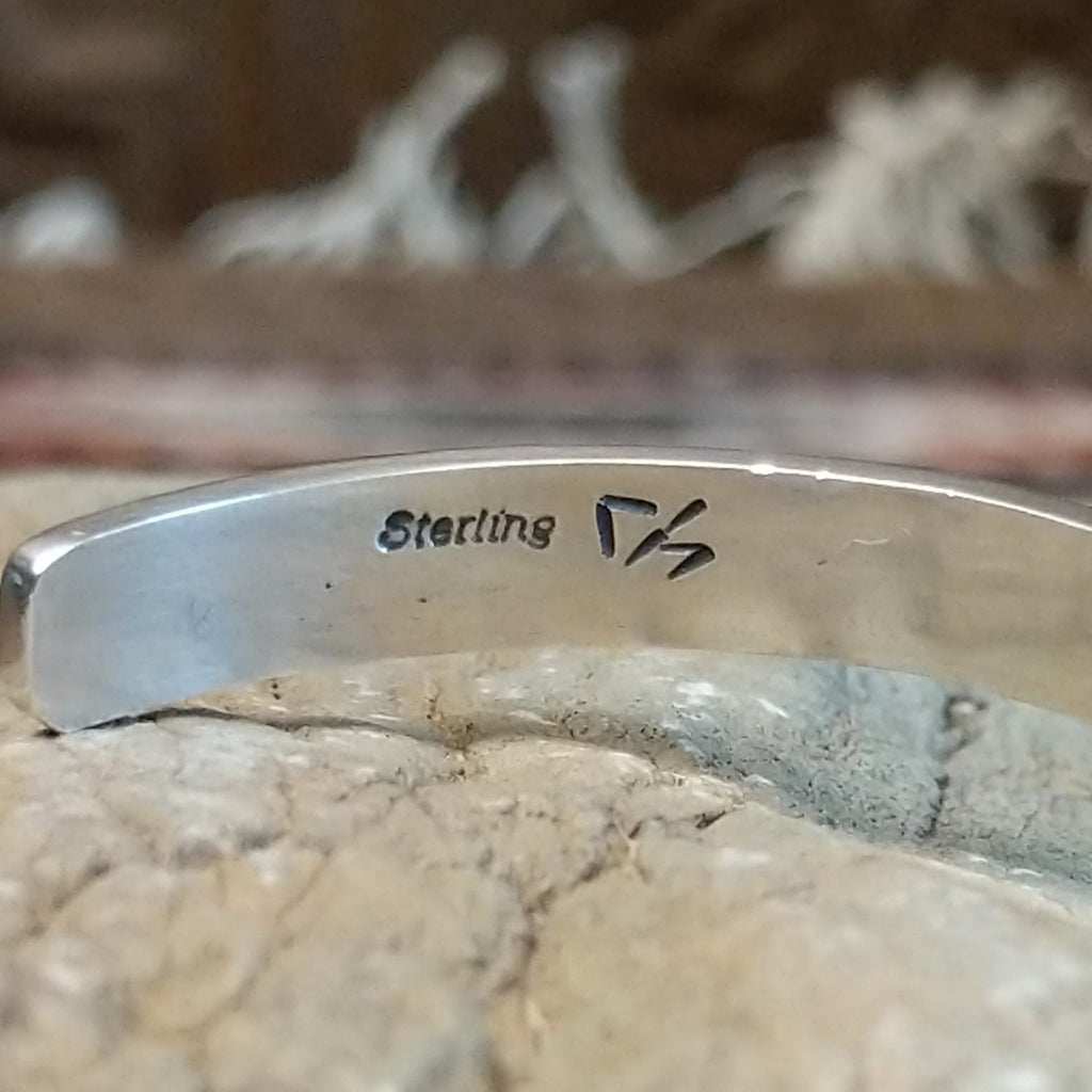 Close-up of the artisan's hallmark.