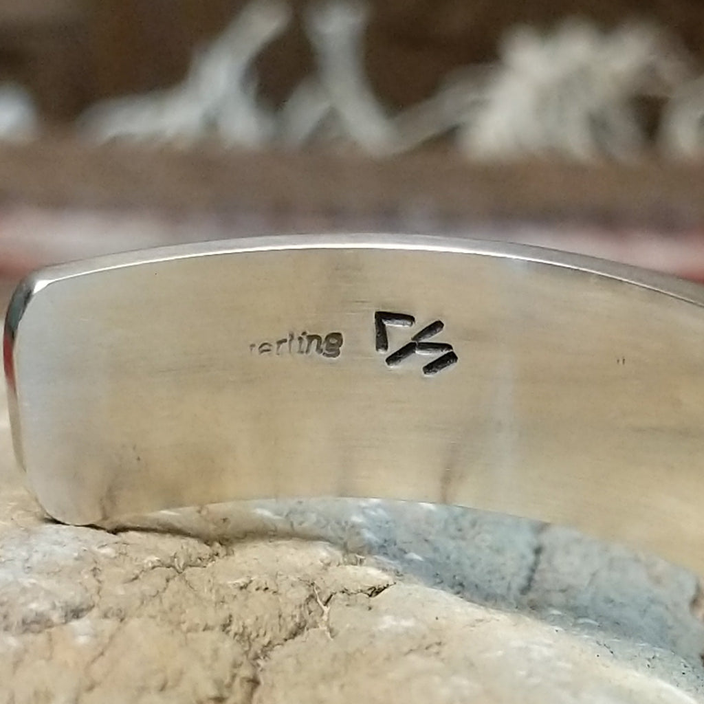 Close-up of the artisan's stamp.