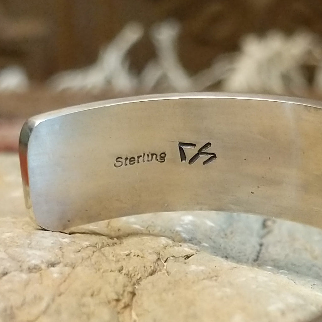 Close-up of the artisan's hallmark.