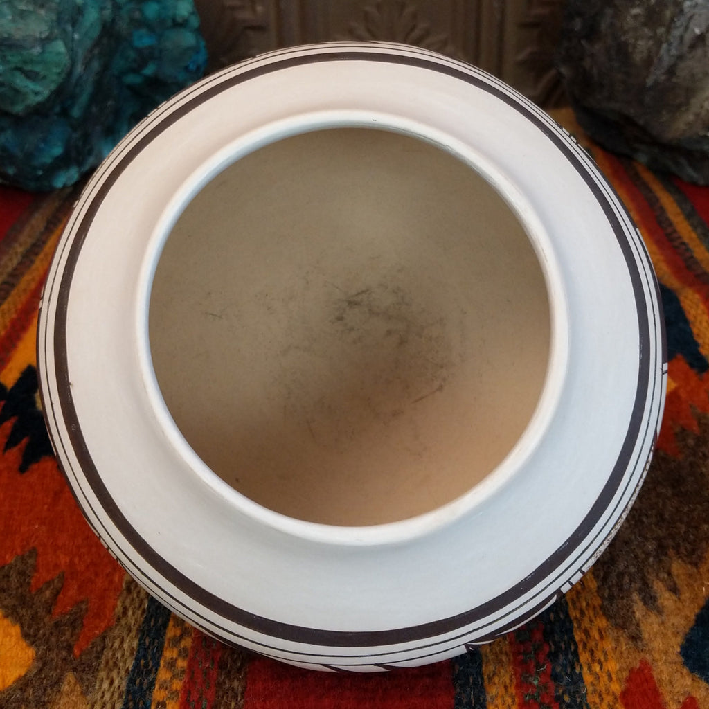 The inside shows the smooth lip and interior of the pot.