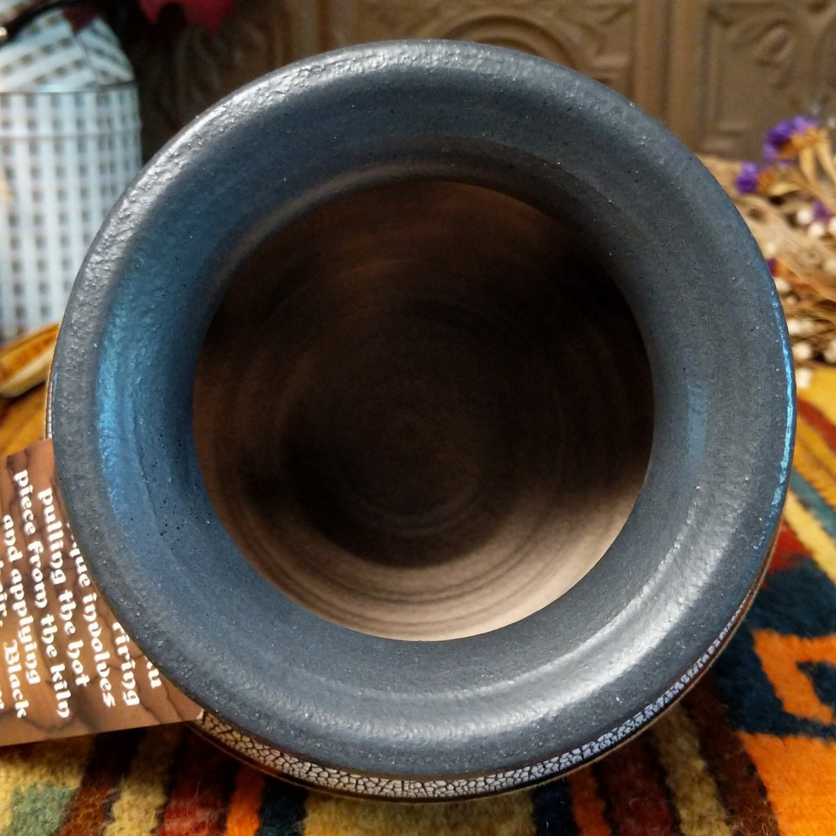 This distinctive Horsehair Pottery by Roger Calhoun features a rounded ceramic vessel with natural earth tones, delicate black horsehair patterns, a decorative crackled upper section, and a wide black rim; top view.
