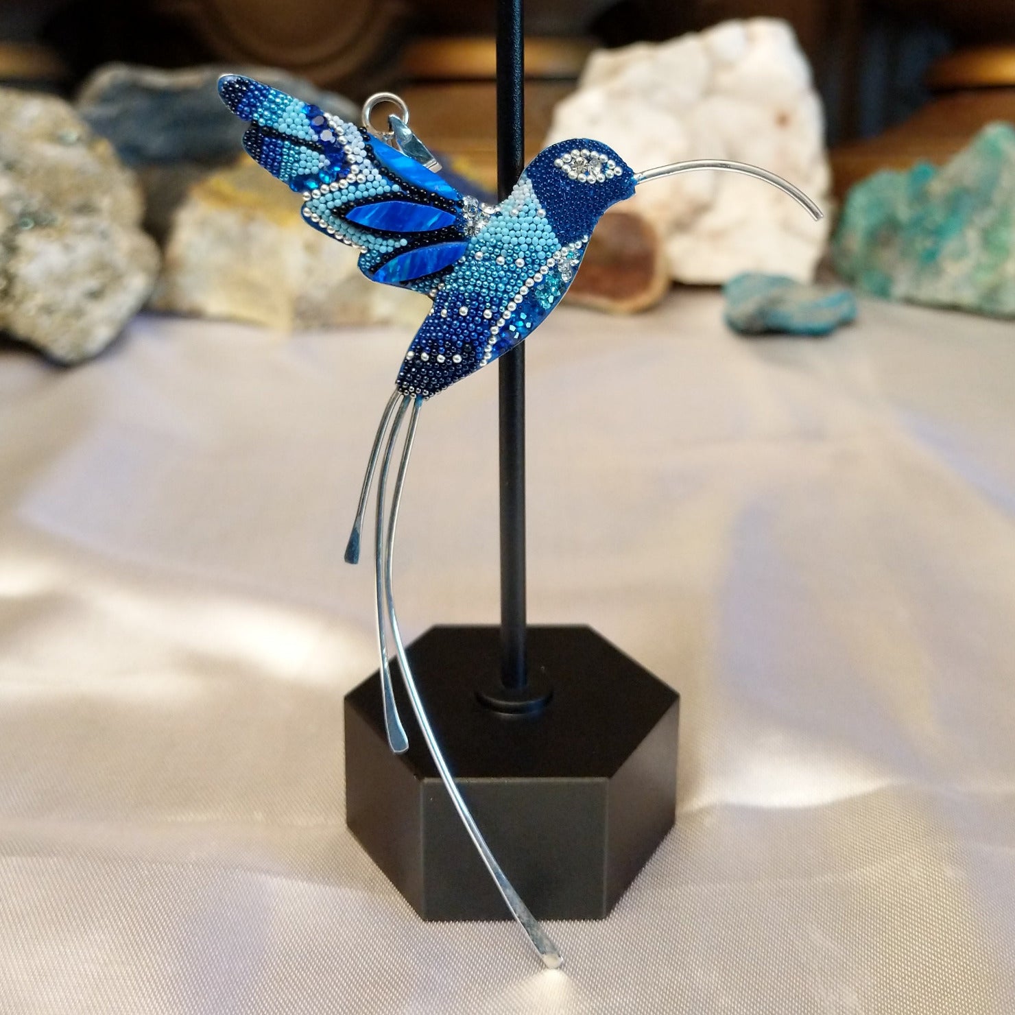 Sterling silver hummingbird pendant with blue Austrian crystals.
