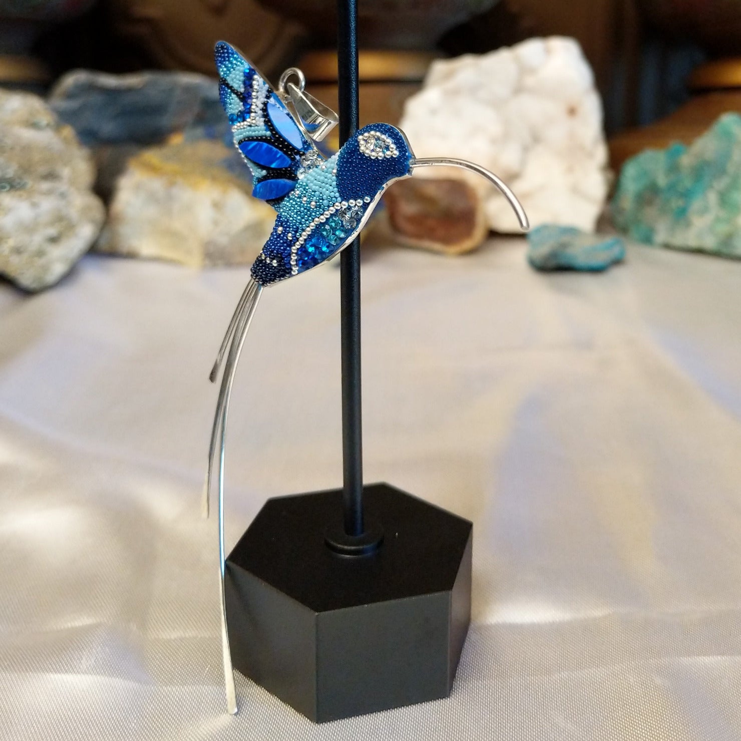 Sterling silver hummingbird pendant with blue Austrian crystals.