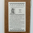 Close up of the Certificate of Authenticity and Artist information. 