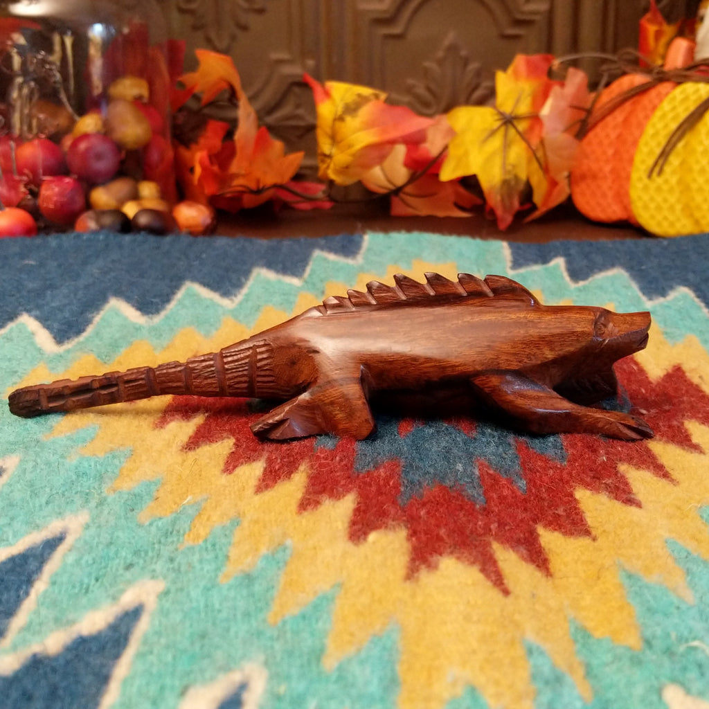 Ironwood carved into a detailed, smooth iguana.