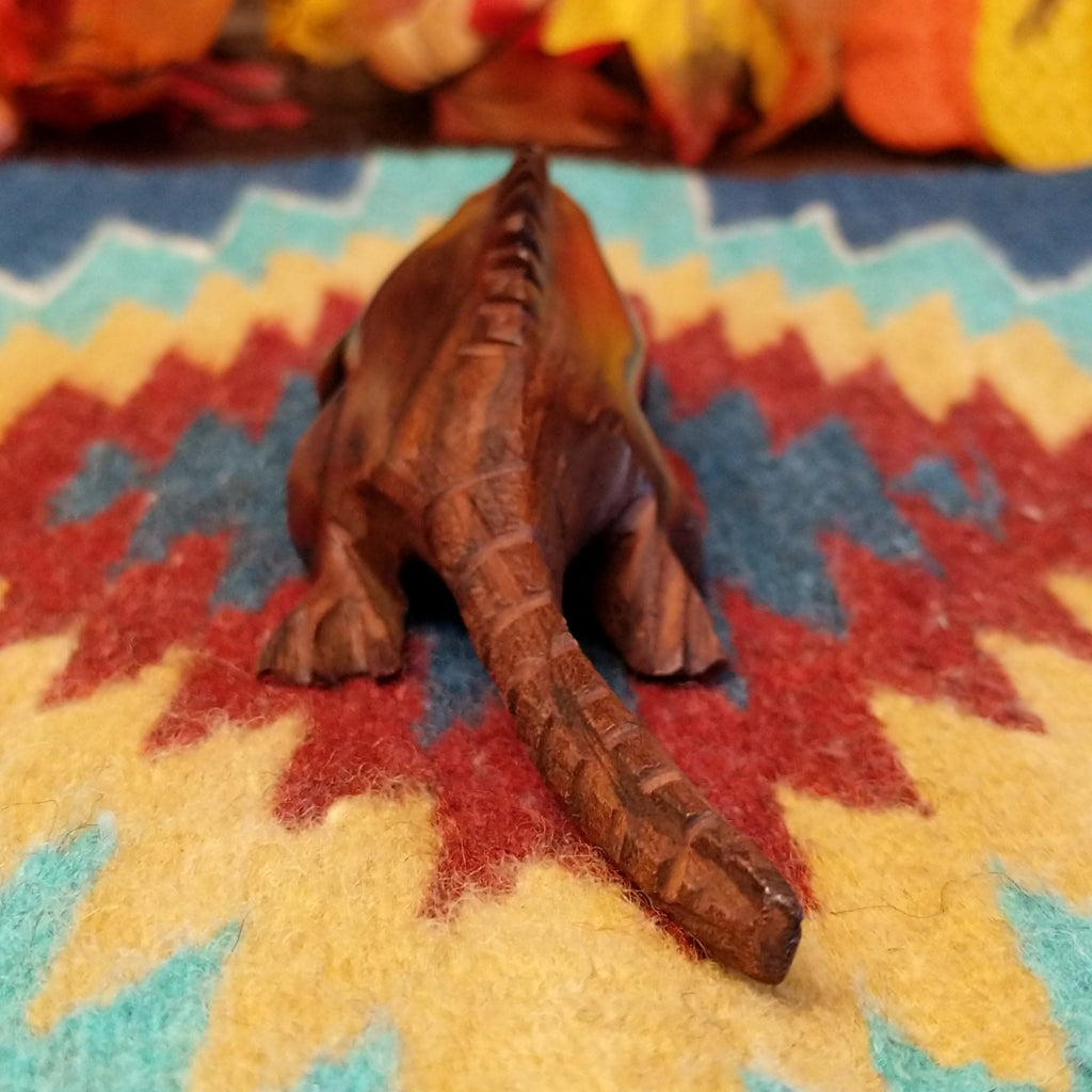 Ironwood carved into a detailed, smooth iguana.