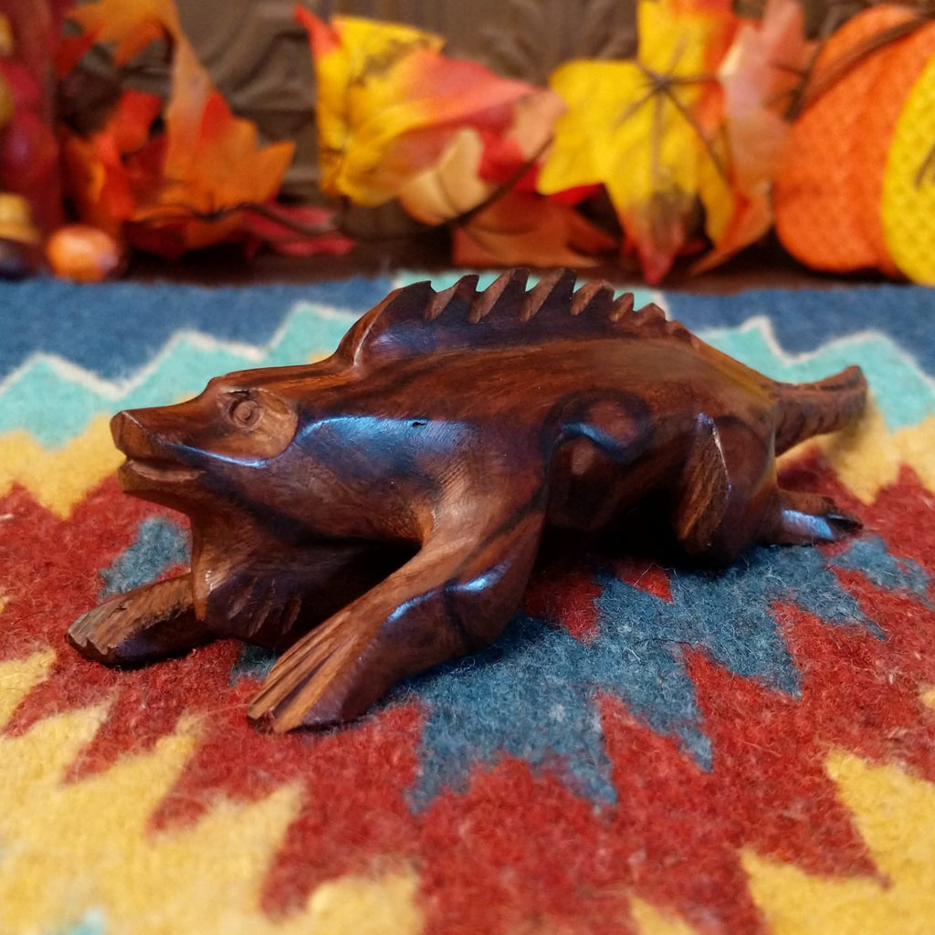 Ironwood carved into a detailed, smooth iguana.