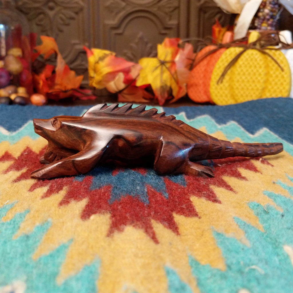Ironwood carved into a detailed, smooth iguana.
