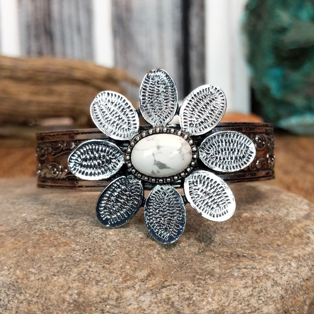 Nickel-free metal bracelet with a white stone center and etched petal accents.