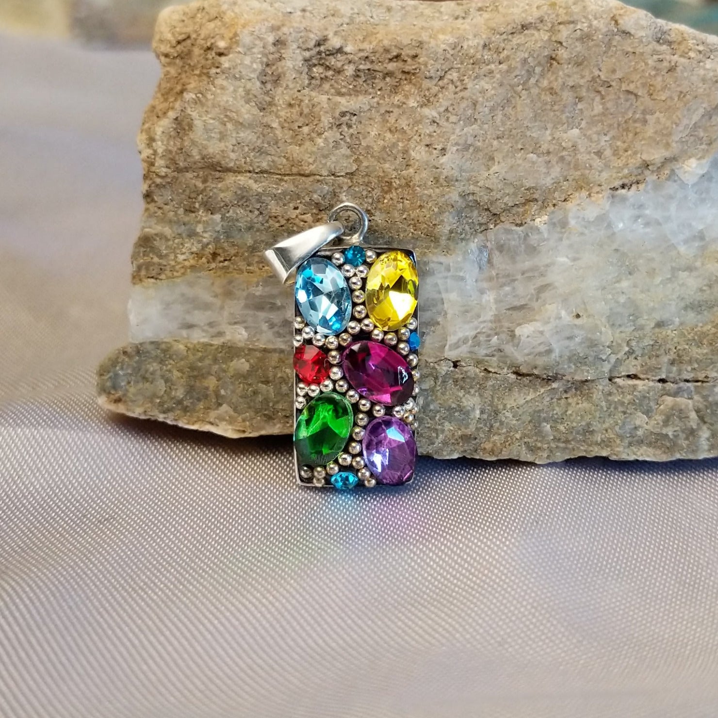 Sterling silver bar pendant with multicolored Austrian crystal.