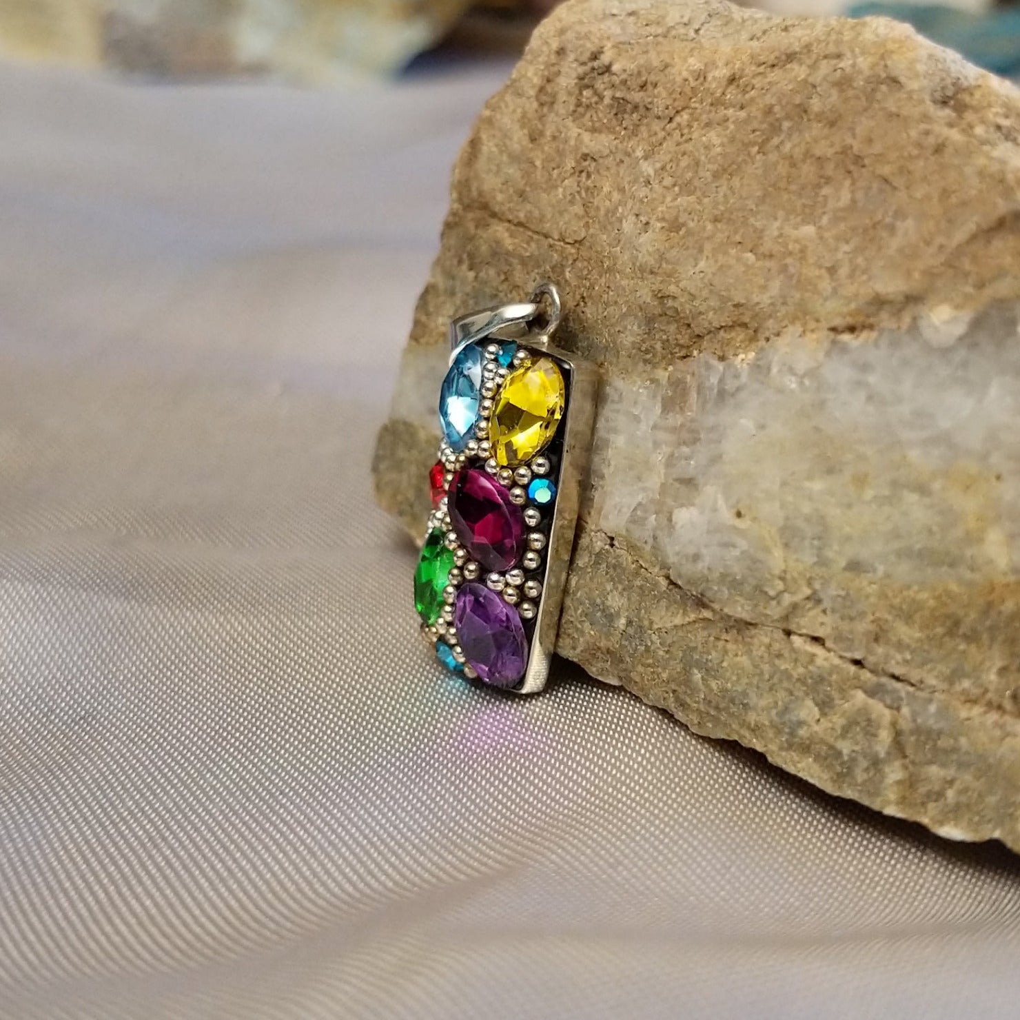 Sterling silver bar pendant with multicolored Austrian crystal.