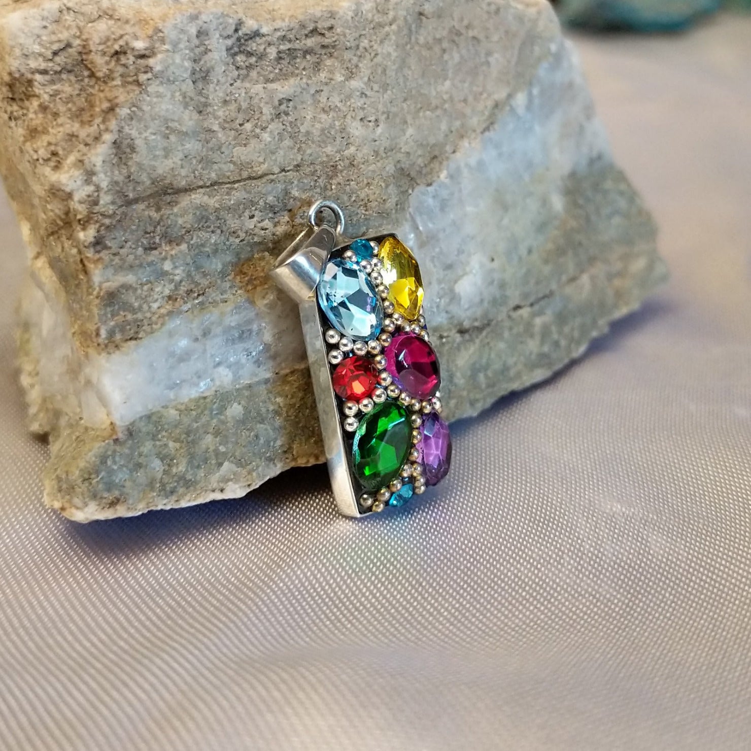 Sterling silver bar pendant with multicolored Austrian crystal.