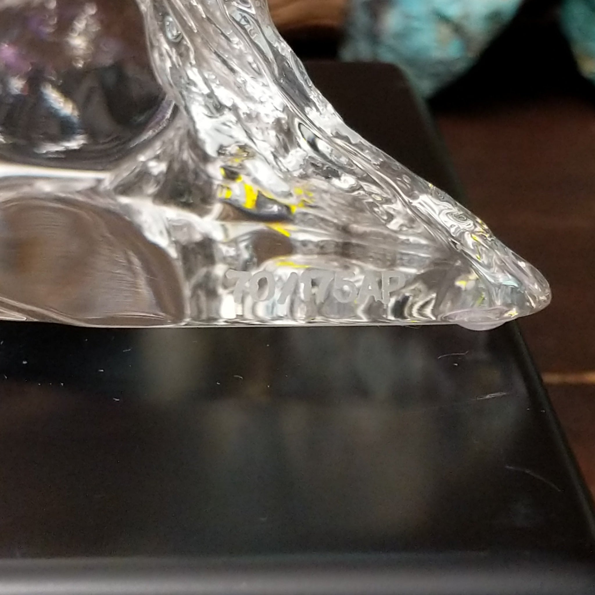 A frosted Lucite sculpture of a bald eagle with a hand-painted bald eagle soaring through the clear crystal interior; production number.