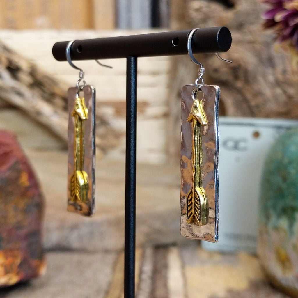 Metal earrings with a gold-tone arrow on a rectangular base.