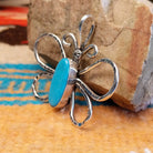 Sterling silver butterfly pendant with Kingman turquoise set in the oval bezel.