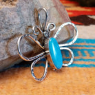 Sterling silver butterfly pendant with Kingman turquoise set in the oval bezel.